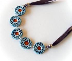 Statement necklace in shades of blue and red ceramic jewelry spring collection