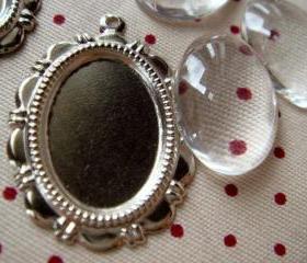 10 Sets of Transparent Oval Glass Domes (13mmx18mm) and matching Silver Photo Frames