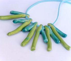 Statement necklace in shades of green and turquoise Spring trends 2012