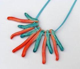 Statement necklace in shades of orange and turquoise Spring trends 2012