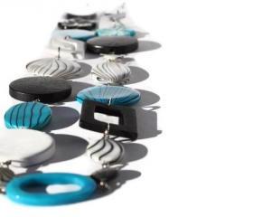 Long chunky necklace in electric blue, black and white.