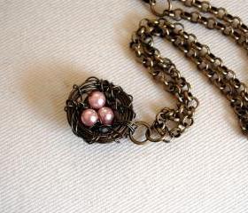 Bird nest necklace with pink pearl