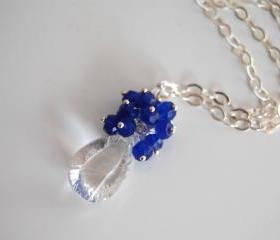 Rock crystal concave cut necklace with ink blue jade