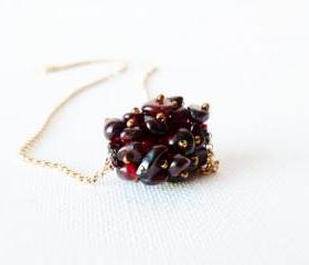 January birthstone. Garnet unique beaded bead pendant on gold field chain.