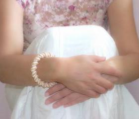 Wedding Pearl white golden peach Cellini spiral. Beaded bangle bracelet. Bridesmade party
