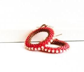 Elegant red hoop earrings. white bronze bead woven round shapes. tbteam.