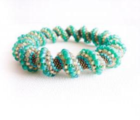 Spring teal green peach turquoise bronze beaded Cellini spiral bracelet. fashion jewelry