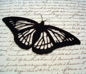 Black butterfly on felt