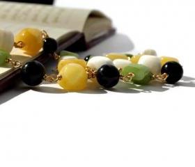 Beaded gemstone necklace made of jade and howlite in white, apple green, sunny yellow and black. Spring fashion. Ready to ship.