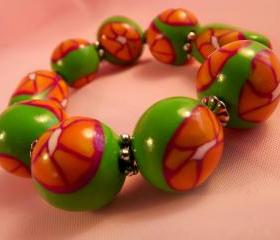 Polymer bangle bracelet, Stretchy polymer bangle, green, tangerine, orange, white. handmade.