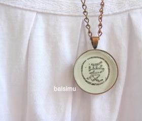 Love. Round copper necklace handprinted 
