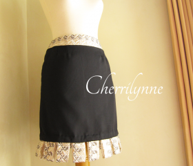Black Skirt with Loops Detail at The Hem