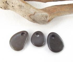 Top drilled beach pebbles. Spanish drilled beach rocks. 3 Natural and smooth beads by Ocean gifts.