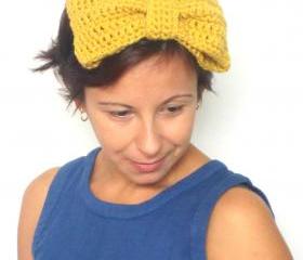 Enormous bow fascinator, crochet headband in burnt yellow.