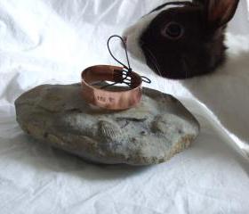 Love you bracelet: A classic copper bracelet with I love you hand stamped onto it.