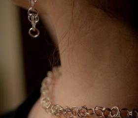 Clip-on Silver earrings: A pair of sterling silver byzantine chain maile earrings with each link soldered.