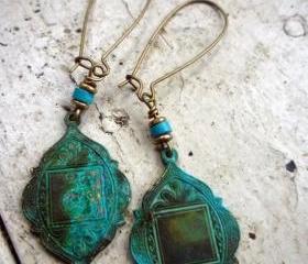 Arabian Medallions in Verdigris Patina. Cocunut rondelle bead. Brass spacer beads. Brass kidney ear wire. Green. Turquoise.
