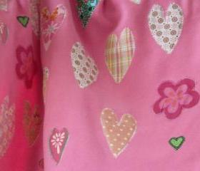 pink baby blanket with hearts and flowers