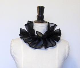 Black organza cirque neck ruffle.