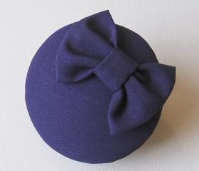 Purple bow cocktail hat.