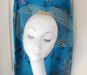 Champagne birdcage veil.