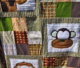 monkey, lion, and girraffe crib quilt