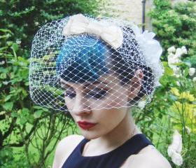 Ivory silk bow birdcage veil.
