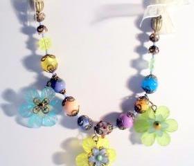 floral bib necklace with ribbon woven chain