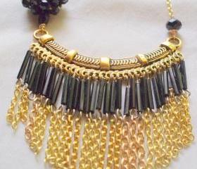 black and gold bib necklace with chain fringe