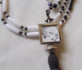 flapper necklace in black and white with tassel and picture charm