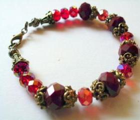 Art Nouveau red crystal bracelet with vintage bead caps