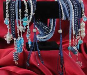 Handfasting cord in luxurious blue and ivory satin braid with woven blue Moroccan ribbon with gemstones, crystals and wire wrapped beads