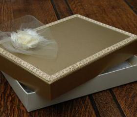 A5 Keepsake presentation gift box. Ivory coloured card box with satin gold finish lid. Gold braiding and ivory chiffon flower to decorate