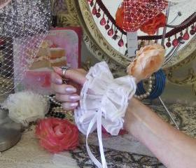 Ivory organza wrist cuffs.