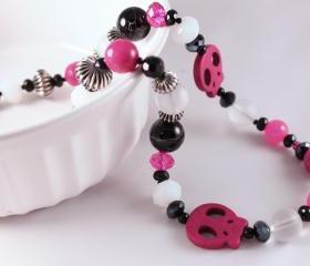 pink and black skull necklace