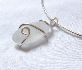 White sea glass pendant on silver choker