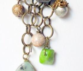 layered chain necklace with blue and green stone pendants and beads