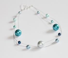 Blue glass pearl floating multi strand illusion necklace.