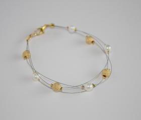 Ivory freshwater pearl and gold stardust bead floating multi strand illusion bracelet
