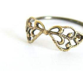 Delicate filigree ring. Sterling silver and vintage brass filigree bow.