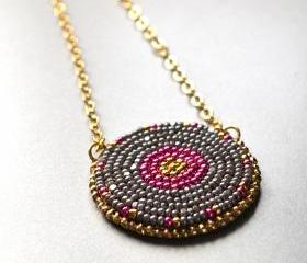 Pink and gray seed bead embroidered pendant on gold plated chain