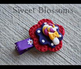 crochet flower hair clip topped up with polymer clay bead 