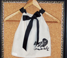 Girls dress in taupe cotton and black bird screen print with a black gros grain ribbon adjust to fit
