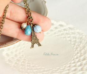 In the foggy sky, Eiffel Paris necklace, in blue, dusty blue, vintage style