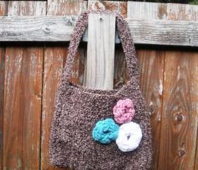 Brown boucle crochet shoulder purse with floral rose detail at front and flannel butterfly lining.