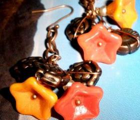 Glass flower earrings in Tangerine, golden yellow, and copper