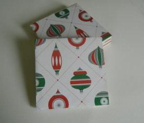Set of 4 sealed Christmas tree print tile coasters with felt pads. 