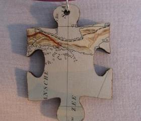 lasercut wooden map pendants - piece of the world