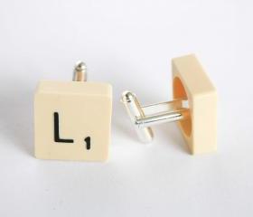 Left and right scrabble tile cuff links.