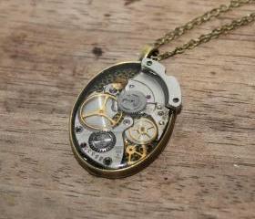 Pretty steampunk style pendant from vintage watch parts